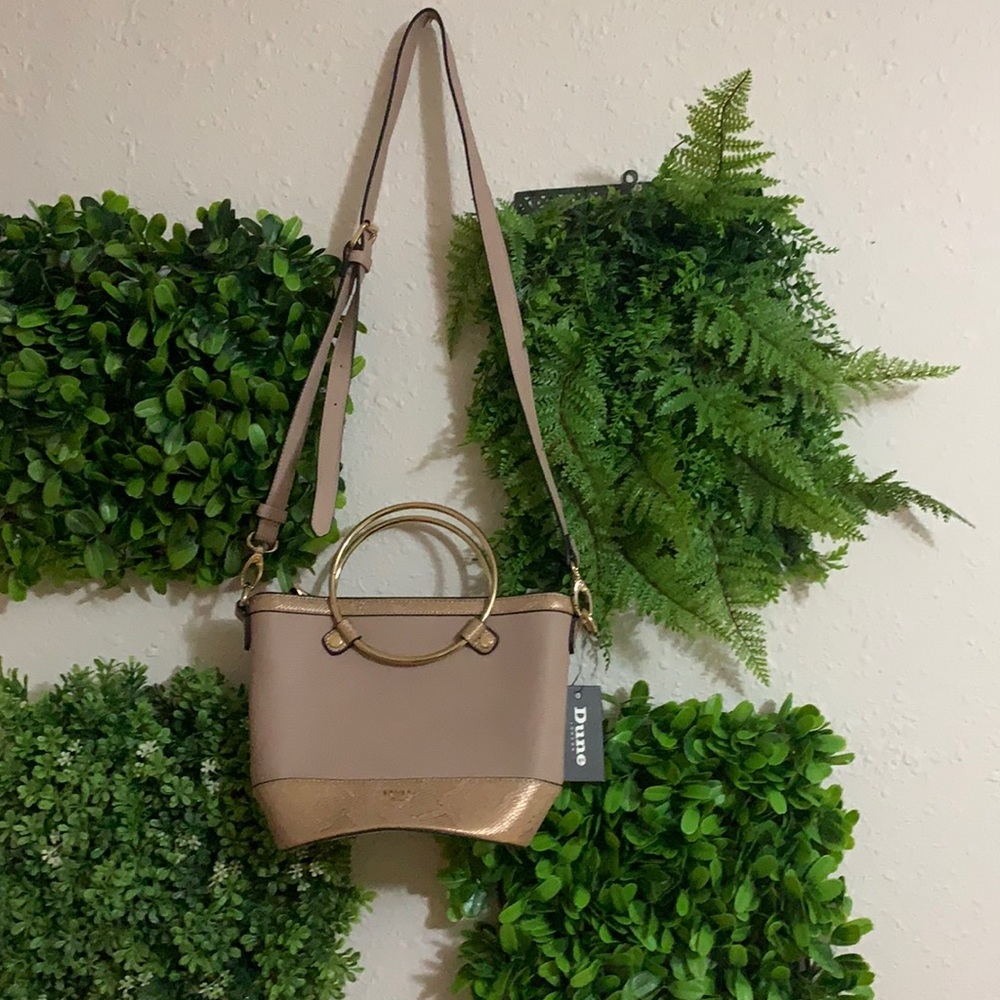 Small purse with strap and handles. New.